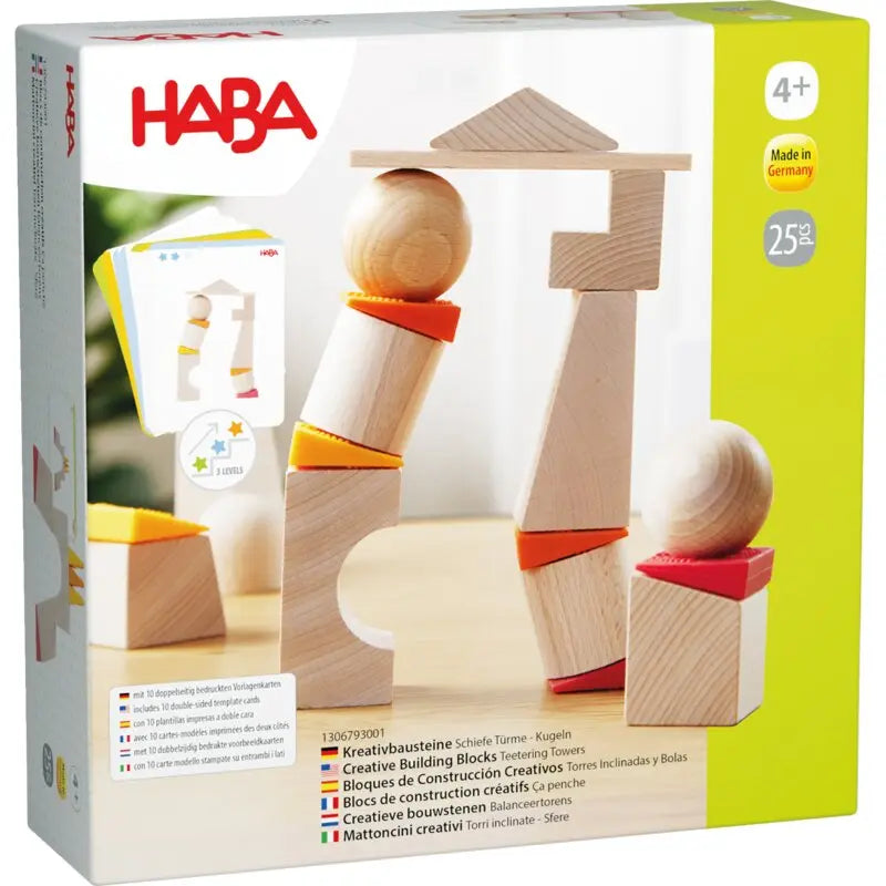 Nahaufnahme der 6 Silikonkeile und Holzbausteine des TüftelTürme-Sets von HABA