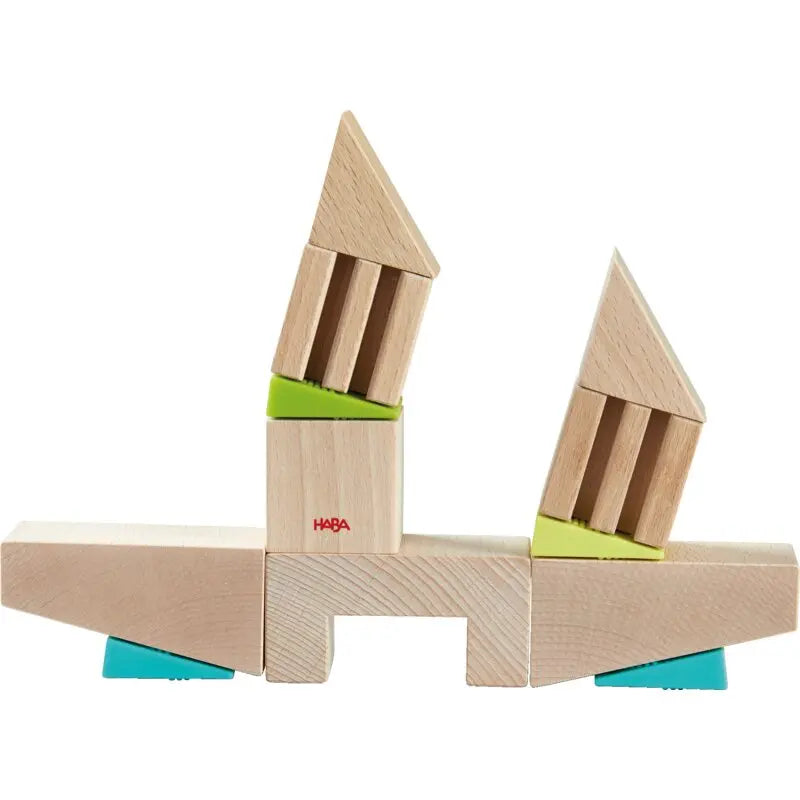 HABA Kreativbausteine Balance & Baukunst – Set mit Holzbausteinen und Silikonkeilen